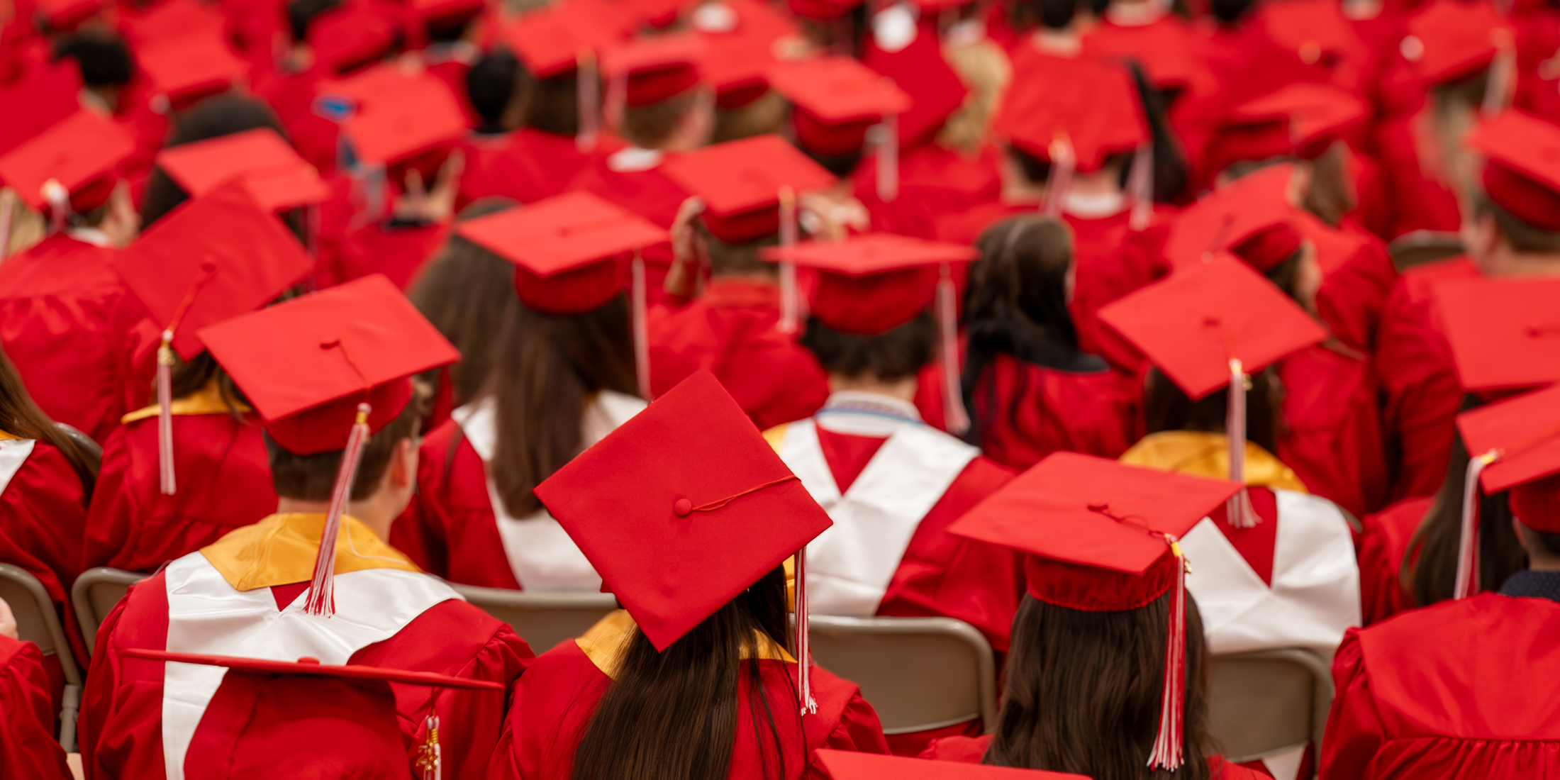 CGHS Class of 2026 seniors in red caps and gowns.