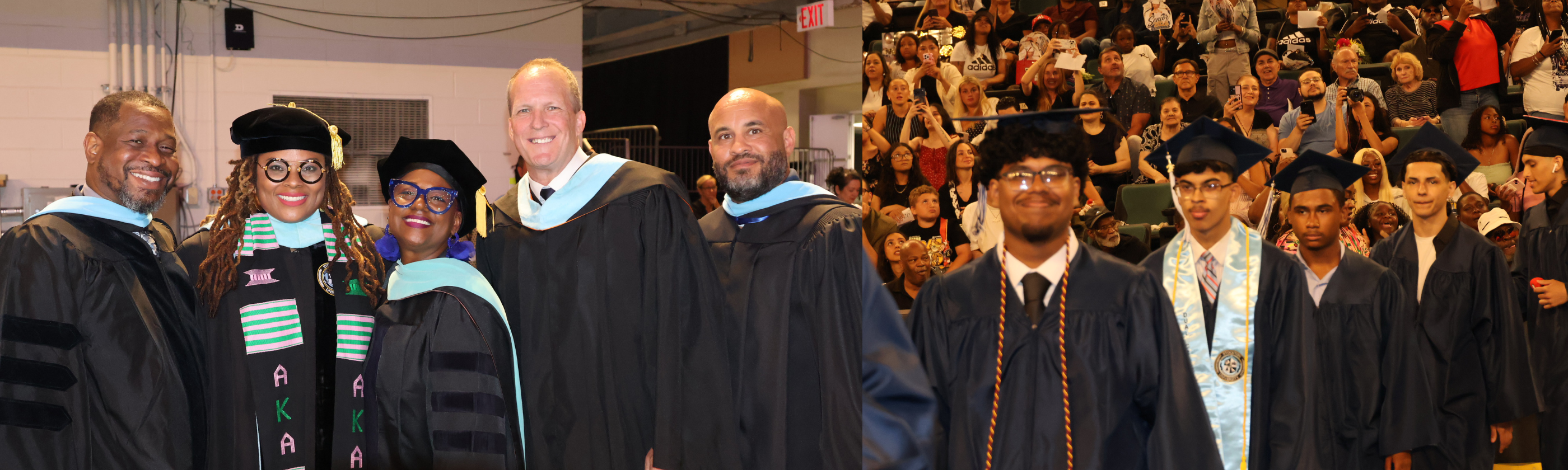 A group of graduates in academic regalia pose for a photo in the foreground, while an audience watches from the bleachers in the background.