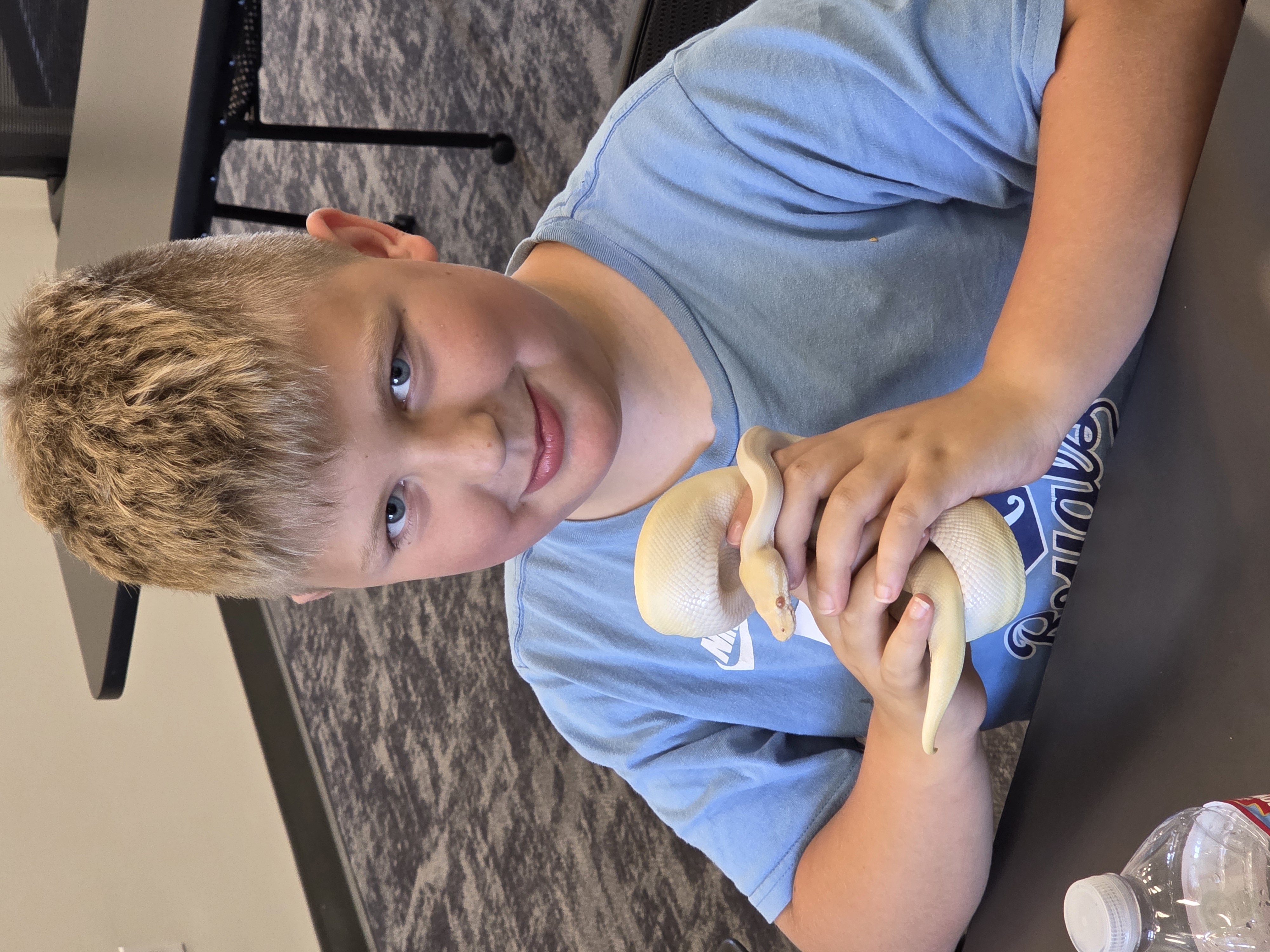 boy holding snake