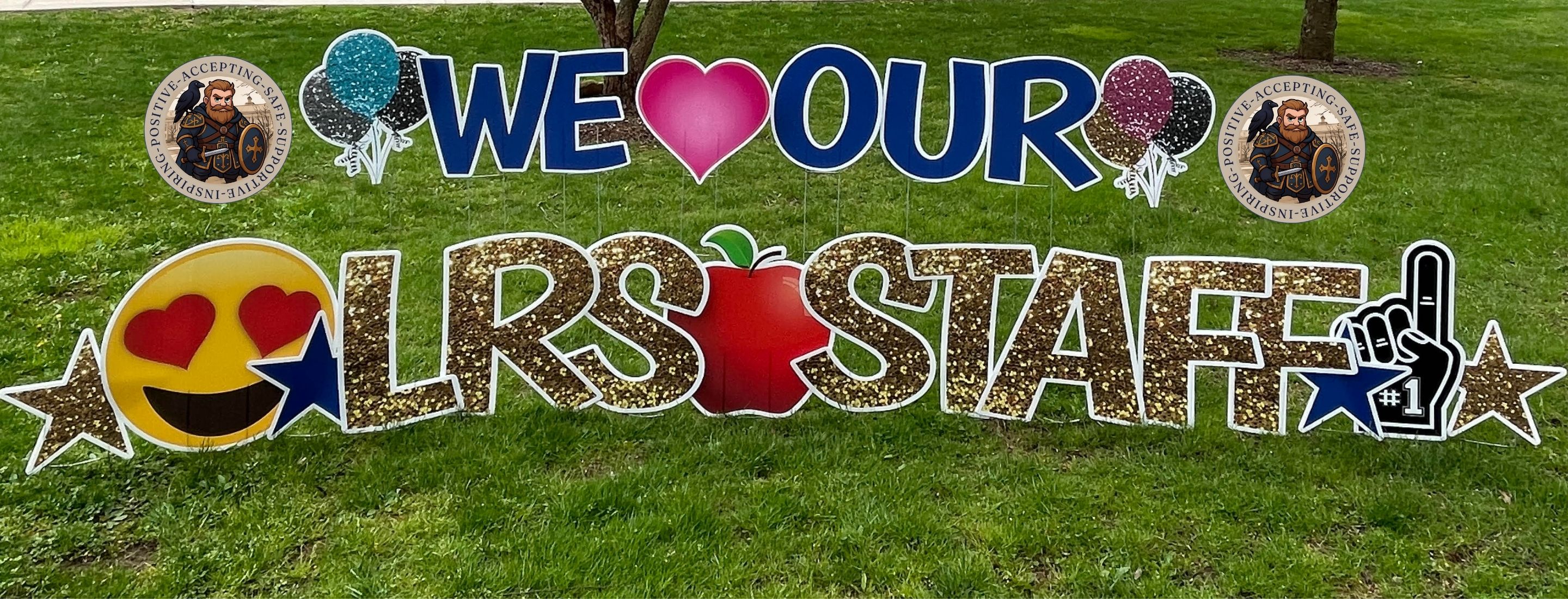 Lawn sign stating "we love our LRS staff"