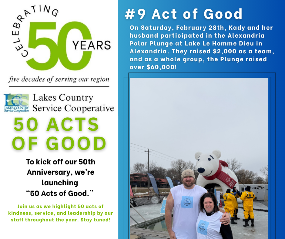A man and woman stand in front of a large inflatable polar bear at an outdoor event, with text on the left celebrating 50 years of service.