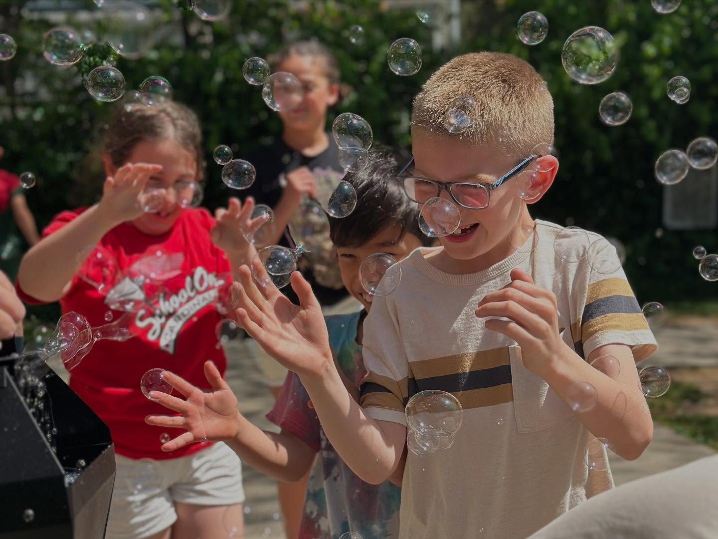 Preschool and Kindergarten students enjoying and outdoor activity