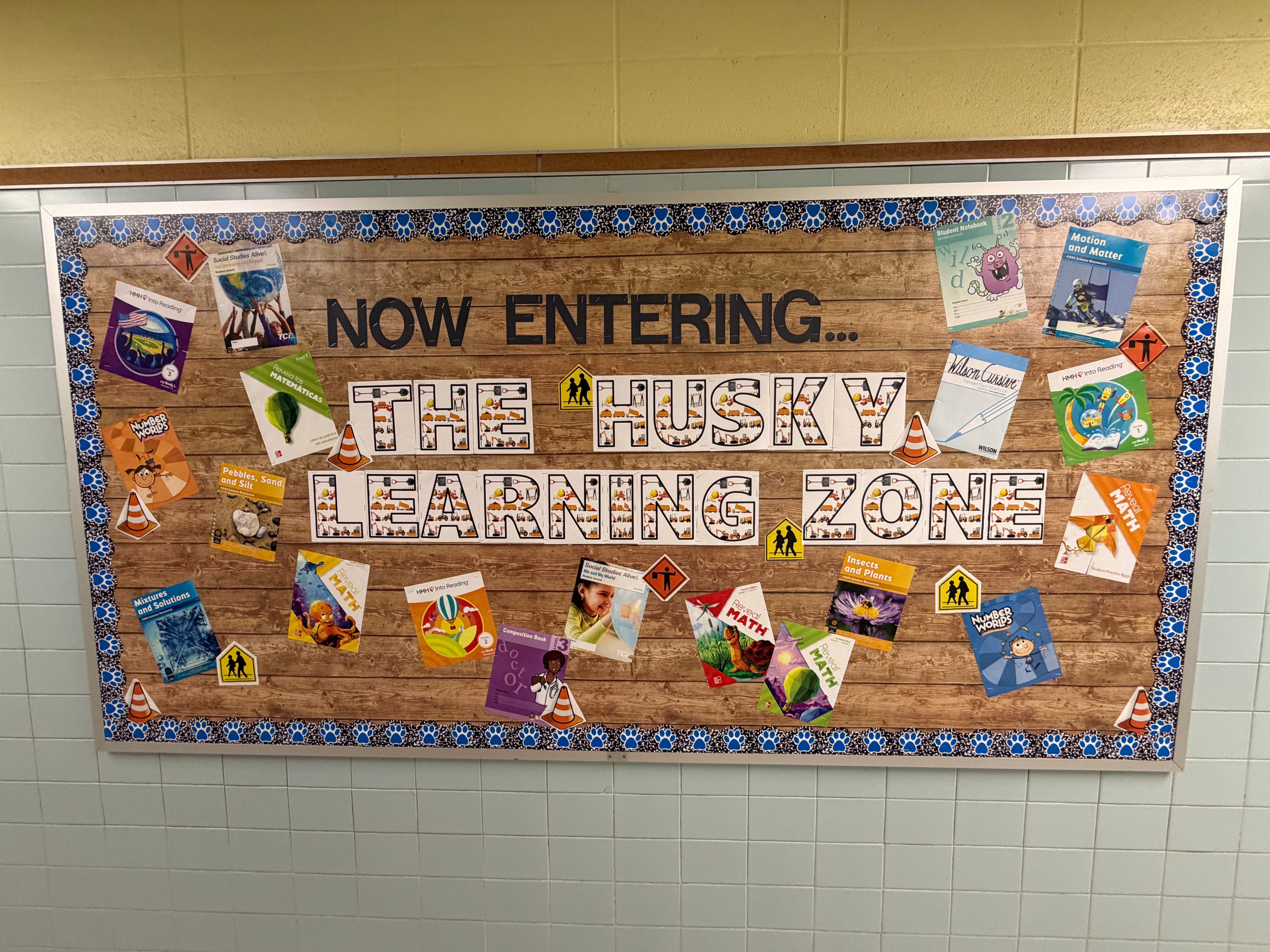 A bulletin board states "Now Entering the Husky Learning Zone"