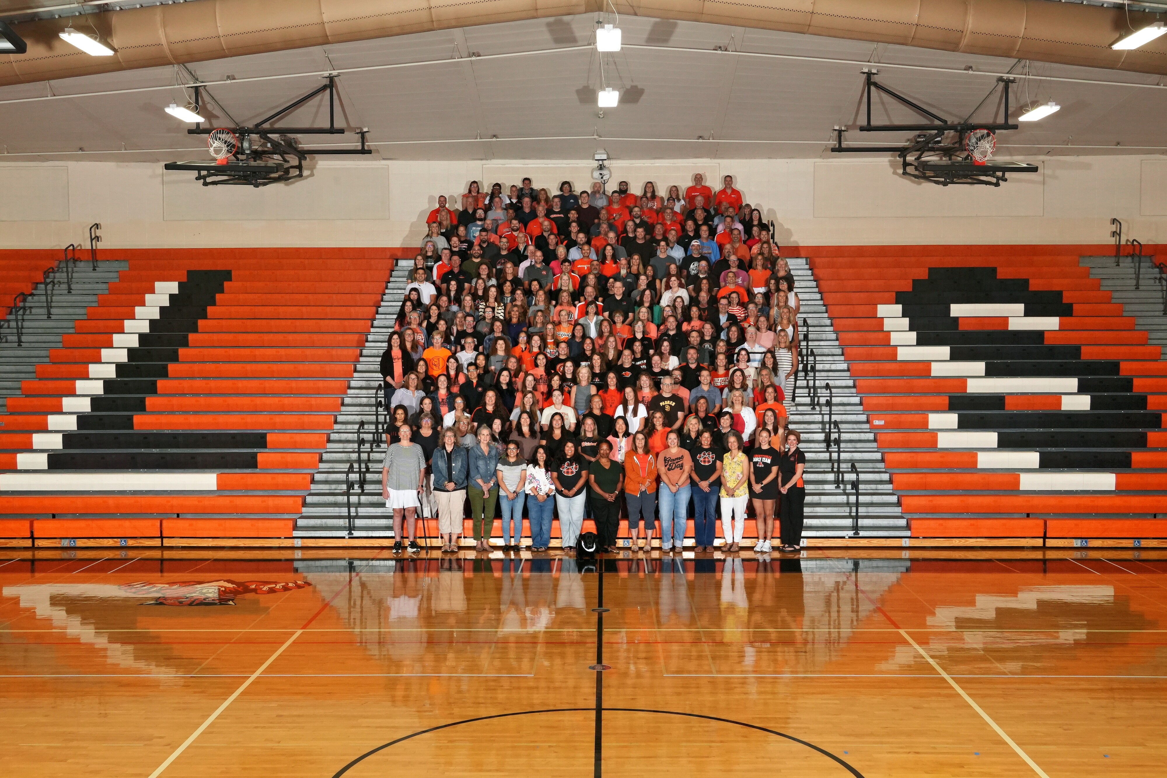 LHS Staff on the bleachers in the gymnasium