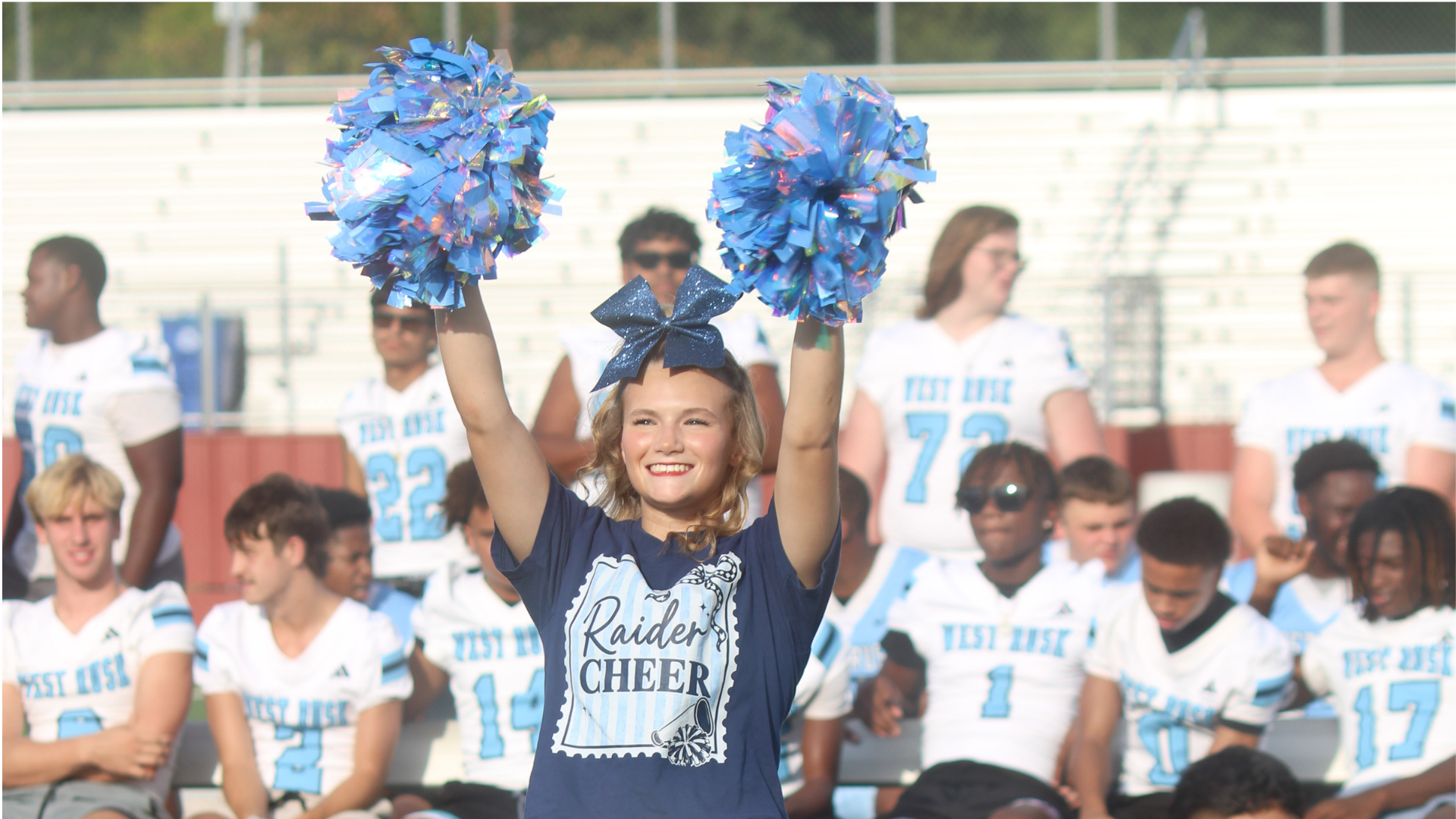 A cheerleader from West Rusk High School cheers
