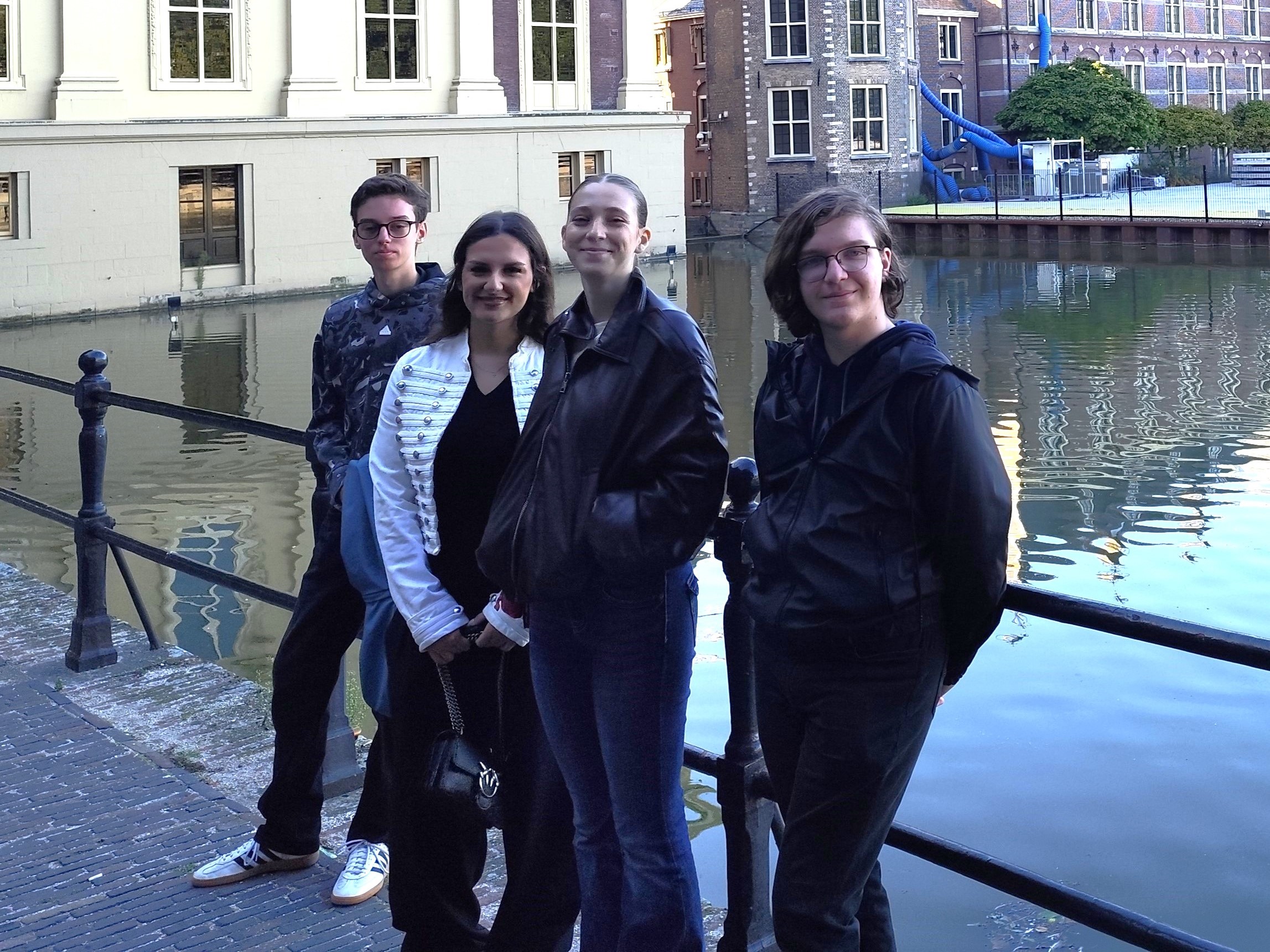 NOVA students posing beside a city canal