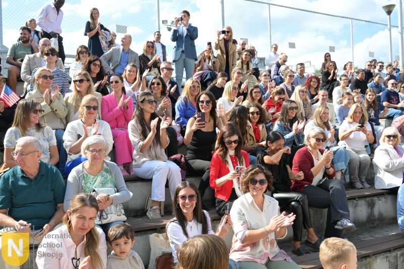Audience of families cheering from the stands at the Parade of Nations