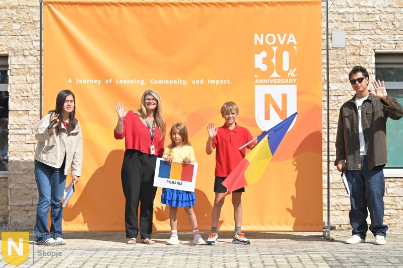 Family with children holding flags at the Parade of Nations
