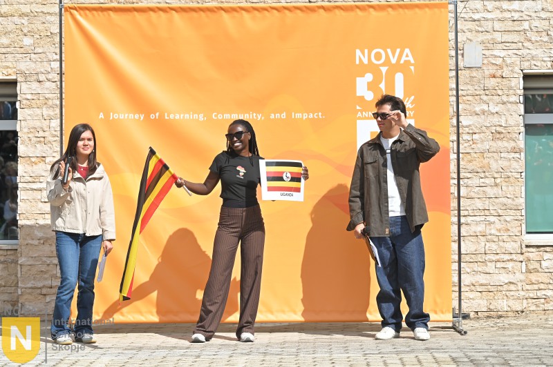 Parent holding the German flag at the Parade of Nations