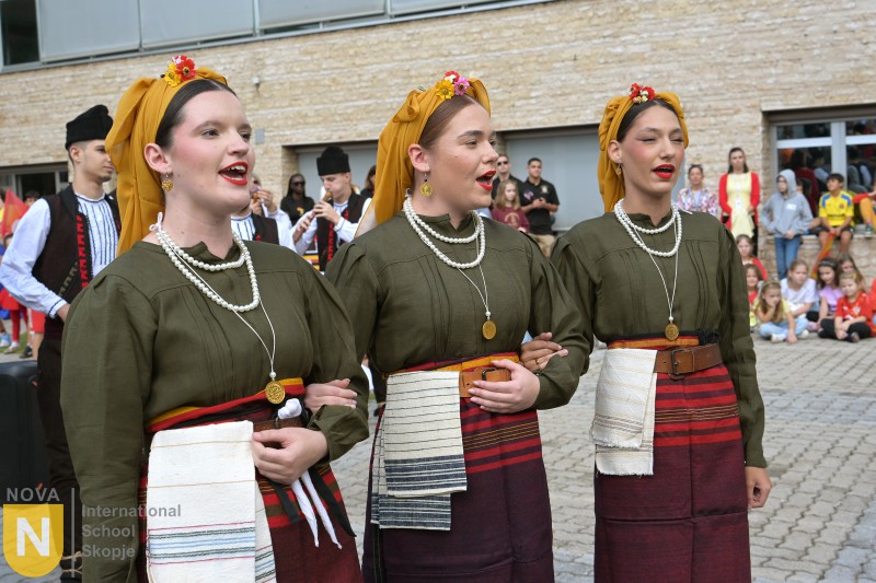 Female folk dancers in traditional costume and headdresses