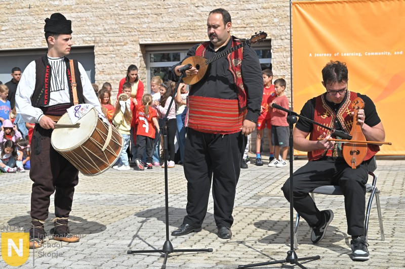 Musicians playing a drum and traditional instruments at the Parade of Nations