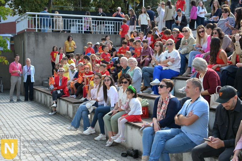 Families watching from the outdoor steps at the Parade of Nations