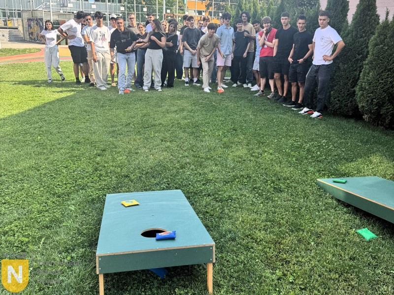 Students lined up on the lawn for a cornhole game during House Pride
