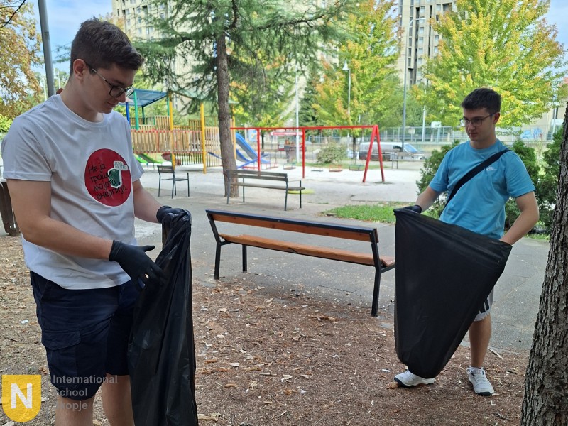 Students collecting litter in a city park