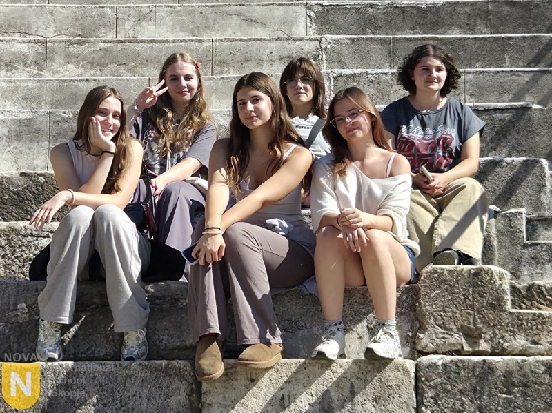Students relaxing on ancient stone steps