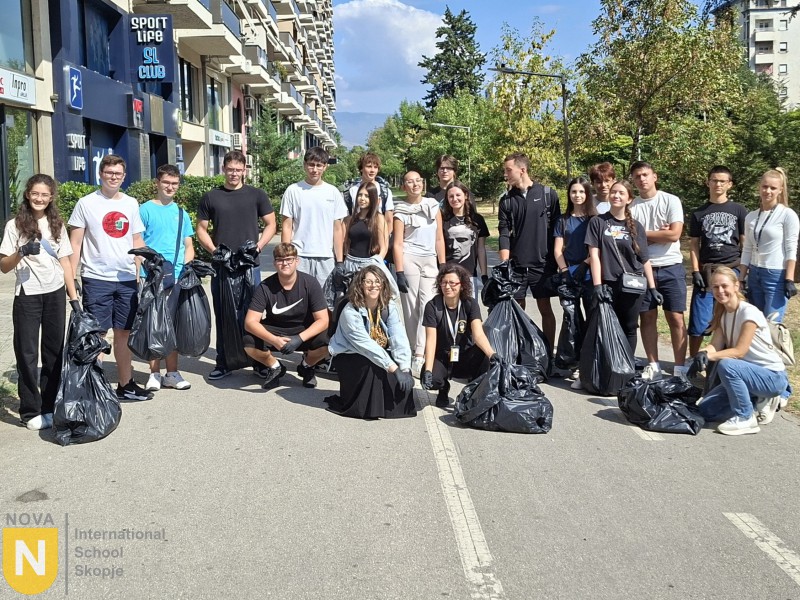 Students with bags of collected litter after a clean-up