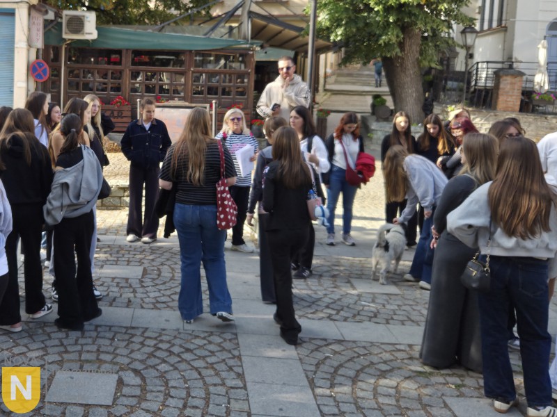Students walking through a cobbled old town street