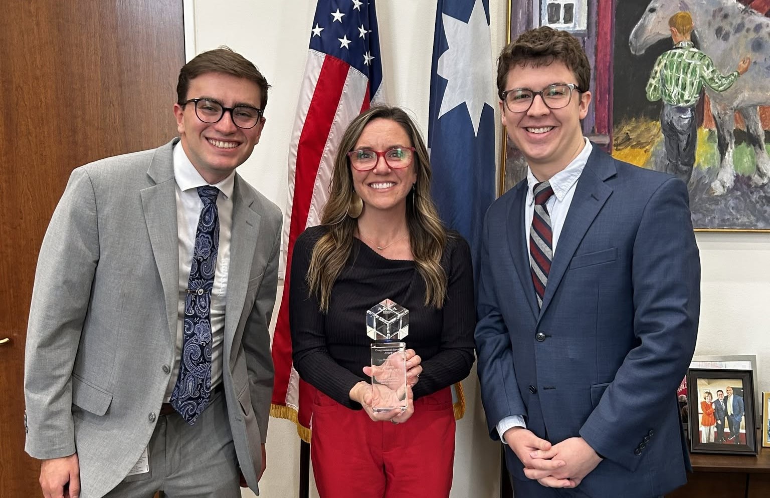 In the photo, SSC Director of Development Sarah Ness presents the award to two members of Senator Smith’s staff: Chris Mirabella, Correspondence Manager and Legislative Aid (left), and Ben Ellgen, Legislative Assistant (right).